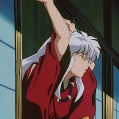 an anime character with white hair and red shirt looking out the window while pointing at something