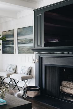 a living room filled with furniture and a flat screen tv mounted above a fire place