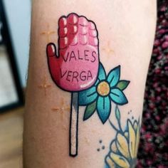 a person with a tattoo on their arm has a pink lollipop that says vale's vegaa