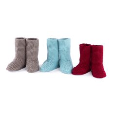 three pairs of crocheted booties are lined up in different colors and sizes