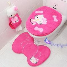 a pink toilet with hello kitty on it