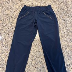 Nwot Athleta Navy Joggers With Zip Pockets. Unique Scrunching Detail Down The Sides! Beautiful Color And Soft Material. Size: 2 Stretch Sports Joggers With Pull-on Style, Navy Stretch Activewear With Elastic Waistband, Casual Running Pants With Pockets, Stretch Pull-on Jogging Pants, Stretch Jogging Pants With Pull-on Style, Navy Activewear With Elastic Waistband For Workout, Athleisure Pull-on Pants For Jogging, Athleisure Jogging Pants With Pull-on Style, Stretch Navy Activewear With Pockets