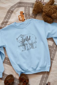 Calling all fashion-forward folks who want to show off their love for the Hudson Valley! This Wild Bear Hudson Valley New York Cute Graphic Crewneck Sweatshirt is a must-have addition to your wardrobe. The sweatshirt is made by Gildan and is not only super stylish, but also incredibly comfortable, cozy, and warm. Whether you're snuggled up on the couch, running errands around town, or hitting the trails, this sweatshirt will keep you looking and feeling great. So don't wait - grab yours today and show the world your love for the Hudson Valley in style! * 50% cotton, 50% polyester * Pre-shrunk * Classic fit * 1x1 athletic rib knit collar with spandex * Air-jet spun yarn with a soft feel and reduced pilling * Double-needle stitched collar, shoulders, armholes, cuffs, and hem Wild Bear, Hudson Valley New York, Donut Shirt, Pokemon T, Nike Shirt, Sweatshirt For Women, Nike Tshirt, Nike Shirts, Hudson Valley