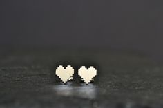 Geeky Nerdy Stud Earrings, 925 Sterling Silver Pixel Heart Earring, Zelda 8 Bit Digital Pixel Video Game Nintendo Jewelry This is a pair of super cute pixel heart stud earrings in 925 sterling silver! Totally cute earrings for modern, geeky and funky style! Would make a perfect distinctive gift for someone special! Material: 925 Sterling Silver Measurements approx.: 8mm Available also in 14K gold plated and 14K solid gold. Also check more --Earrings-- http://www.etsy.com/shop/HardResols?section_ Nickel-free White Sterling Silver Heart Earrings, Cute Silver Sterling Heart Earrings, Cute Silver Heart Earrings In Sterling Silver, White Sterling Silver Heart Earrings Gift, White Sterling Silver Heart Earrings, Cute Sterling Silver Heart Earrings For Gift, Tiny Silver Heart Earrings, Nintendo Jewelry, Pixel Video Game