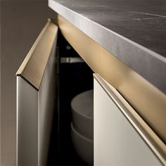 a close up of a metal cabinet and counter top