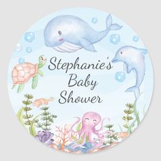 a baby shower sticker with two dolphins and an octopus