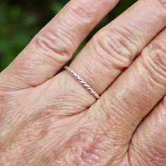 You can't get more simple than this! A classic twisted wire sterling silver stacking ring. You can wear this stacker alone or in a set of stackable rings. It also makes a great gift for a teenager or college student. Here are the details: It is made with 1.63mm (14 ga) solid sterling silver twisted wire. Each ring is handmade to order by Will Macy, in Corvallis, OR. Minimalist Adjustable Twisted Rings, Simple Adjustable Hypoallergenic Stackable Rings, Simple Adjustable Sterling Silver Stackable Rings, Classic Adjustable Sterling Silver Stackable Rings, Modern Twist Stackable Adjustable Midi Rings, Adjustable Stackable Midi Rings With A Modern Twist, Adjustable Twisted Stackable Rings, Gift Midi Rings With A Modern Twist, Modern Twist Adjustable Stackable Midi Rings