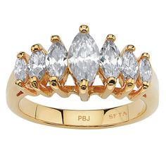 a gold ring with five pear shaped diamonds