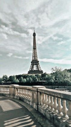 the eiffel tower is seen from across the river