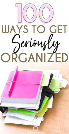 a pile of notebooks with the words, 100 ways to get seriously organized