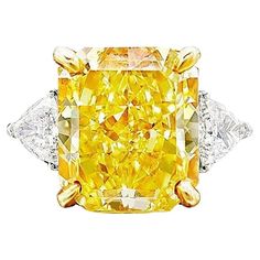 Fantastic GIA Certified 10 Carat Fancy Yellow Radiant Diamond Ring" is a remarkable piece of jewelry. "GIA Certified" indicates that the diamond has been thoroughly examined and authenticated by the Gemological Institute of America, a highly reputable gemological laboratory. This certification assures the diamond's quality and authenticity. The "10 Carat" designation refers to the weight of the diamond, with a 10-carat diamond being exceptionally large and rare. This substantial size adds to the Fancy Yellow Diamond Ring, Radiant Diamond Rings, Graff Diamonds, Orange Diamond, Yellow Diamond Ring, Radiant Cut Engagement Rings, Simulated Diamond Rings, Yellow Diamond Rings, Yellow Engagement Rings