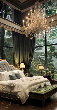 a bedroom with a large bed and chandelier hanging from the ceiling