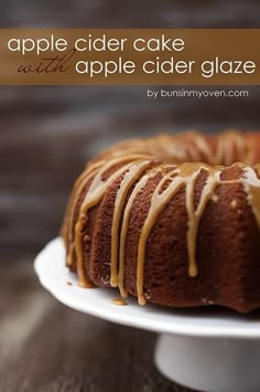 a cake with caramel icing sitting on a white plate