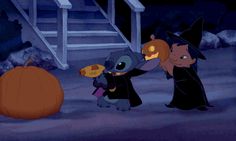 two cartoon characters dressed up as witches and one is holding a candy cornucon