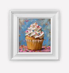 a painting of a cupcake with white frosting and sprinkles