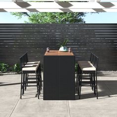 an outdoor dining table with four stools