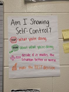 a sign on the wall that says am i showing self - control? what you're doing