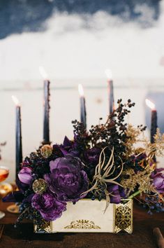 a table with candles and flowers on it