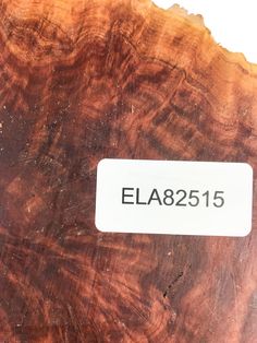 a piece of wood that has been cut in half and is labeled ela8255