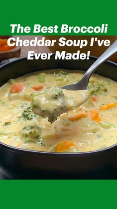 a spoonful of broccoli cheese soup with carrots and celery