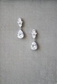 CHERIE Simulated Diamond Drop Earrings WHAT WE LOVE: The delicacy and sparkle of the Cherie Earrings... Quince Earrings, 1950 Outfits, Deb Dress, Quince Planning, Bridal Drop Earrings, Prom Outfit, Modern Mexican, Diamond Tiara, Bridal Earrings Drop