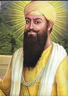 an image of a man with a beard wearing a yellow turban