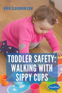 a toddler playing with sippy cups on the floor and text overlay reads toddler safety walking with sippy cups