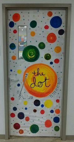 a door decorated with colorful circles and the word, the dot on it's side