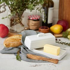 bread, cheese and wine on a table