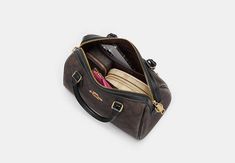 Our sleek and timeless Rowan Satchel is an everyday favorite with inside and outside multifunction pockets. Wear it as a crossbody or top handle bag—it’s a versatile pick that secures your essentials with a zip-top closure. Sling Bag Mini, Coach Satchel, Sustainable Bag, Beautiful Silhouette, Coach Outlet, Weekend Brunch, Coach Wallet, Signature Canvas, Satchel Purse