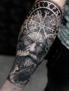 a man with a tattoo on his arm