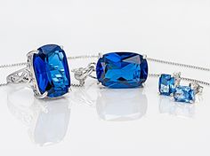 Pre-Owned 38.00ctw rectangular cushion lab created blue spinel sterling silver boxed set. Pendant with chain measures approximately 1 1/8"L X 9/16"W WITH 2 " extenders. 3mm bail and lobster clasp closures. Stud earrings measure approximately 5/16"L X 1/4"W with tension post backings. Solitaire ring measures approximately 3/4"L X 1/8"W. Not sizeable. All are rhodium plated..  This product may be a customer return, vendor sample, or on-air display and is not in its originally manufactured conditio Fine Jewelry With Rectangular Pendant For Formal Occasions, Luxury Square Cut Jewelry With Accent Stones, Luxury Sapphire Sterling Silver Jewelry, White Gold Jewelry With Square-cut Accent Stones, Formal Rectangular Fine Jewelry Gemstones, Elegant Octagon-shaped Jewelry For Evening, Elegant Octagon Shaped Jewelry For Evening, Fine Jewelry Sapphire Square Cut, Formal Sterling Silver Rectangular Pendant