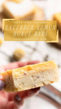 a hand holding a piece of lemon honey bars with the text out and creamy lavender lemon honey bars