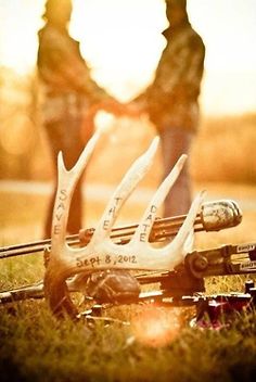 two deer antlers sitting next to each other on the ground