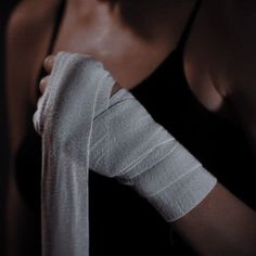 a woman with cast on her arm holding something