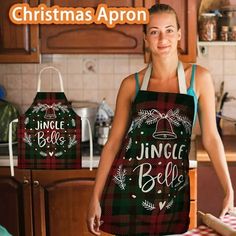 a woman wearing an apron with the words jungle bell on it, standing in front of a kitchen counter