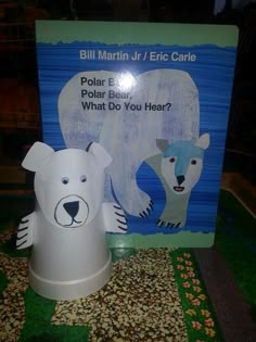 a paper polar bear next to a sign with the words polar bear what do you hear?