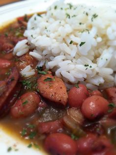 a white plate topped with beans and rice