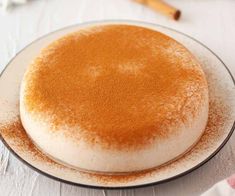 a white plate topped with a cake covered in sugar