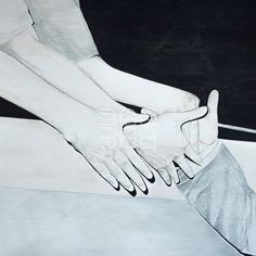 two hands touching each other on a white surface