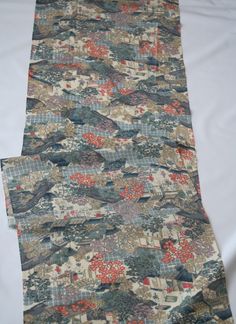 Japanese Silk Kimono fabric from a vintage Japanese kimono. This has been cut into lengths for sewing. Step back in time with this unique kimono fabric, adorned with patterns reflecting the life of ancient Japan. Featuring traditional motifs like Kemari (a historical ball game) and Omikoshi (portable shrines used in festivals), this fabric beautifully captures the essence of Japan's rich cultural heritage. The colors are vibrant yet soft and gentle, adding a subtle elegance to the design.  Material: Silk Type of kimono: KOMON(小紋） Condition: Very good condition  Age: Unknown Origin: Japan Width:36.5cm Length:102 or 162cm Note: The length of this fabric has been updated from the previous listing. Be sure to double-check the current length in the product details before making your purchase to Unique Kimono, Ancient Japan, Vintage Japanese Kimono, Traditional Motifs, Subtle Elegance, Japanese Textiles, Japanese Silk, Kimono Fabric, Silk Kimono