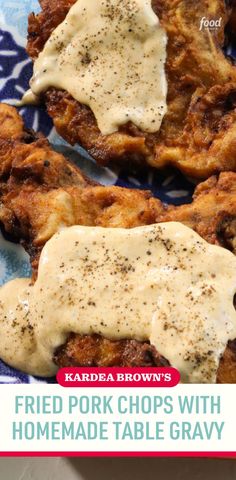 fried pork chops with homemade table gravy on a blue and white plate