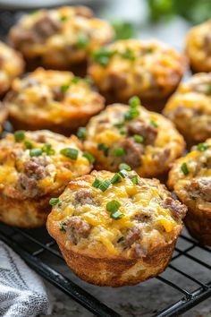 muffins with meat and cheese on a cooling rack