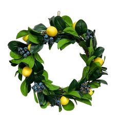 a wreath with lemons and blue berries