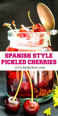 a jar full of pickled cherries with a spoon in it and the words, spanish style pickled cherries