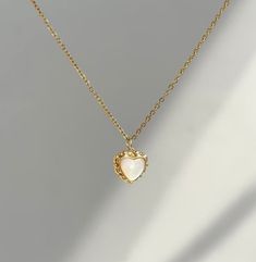 This stunning Necklace is the epitome of elegance and simplicity. Made with a simple design with stunning shell love heart pendant ~ it features a sleek and sophisticated style that is perfect for any occasion. 18k Gold Plated Chain with 12mm*13mm natural Mother of Pearl  love heart pendant  Necklace  Length : 40+5cm extend Lovingly handmade in my home studio in Sydney To help care for your item, avoid contact with chemicals, fragrances and water. Store earrings away from direct sunlight and in Elegant Pearl Pendant Heart Necklace As A Gift, Elegant Heart Necklace With Pearl Pendant For Gift, Elegant Pearl Pendant Heart Necklace Gift, Elegant Heart Necklace With Delicate Chain, Delicate Heart Necklace With Pearl Pendant, Elegant White Heart Necklace, Elegant White Heart Necklace As A Gift For Her, Elegant White Heart Pendant Necklace, Elegant White Heart Necklace For Her