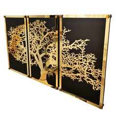 three panels with trees cut out of gold foil on black and white paper, each panel has a tree in the center