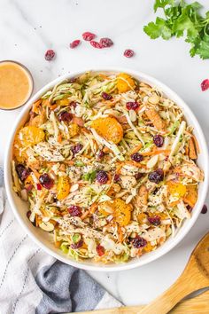 a white bowl filled with salad and dressing