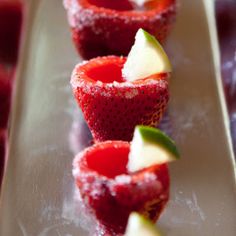 strawberries and apples are arranged on a plate