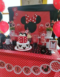 a mom's day dessert table with red and black decorations